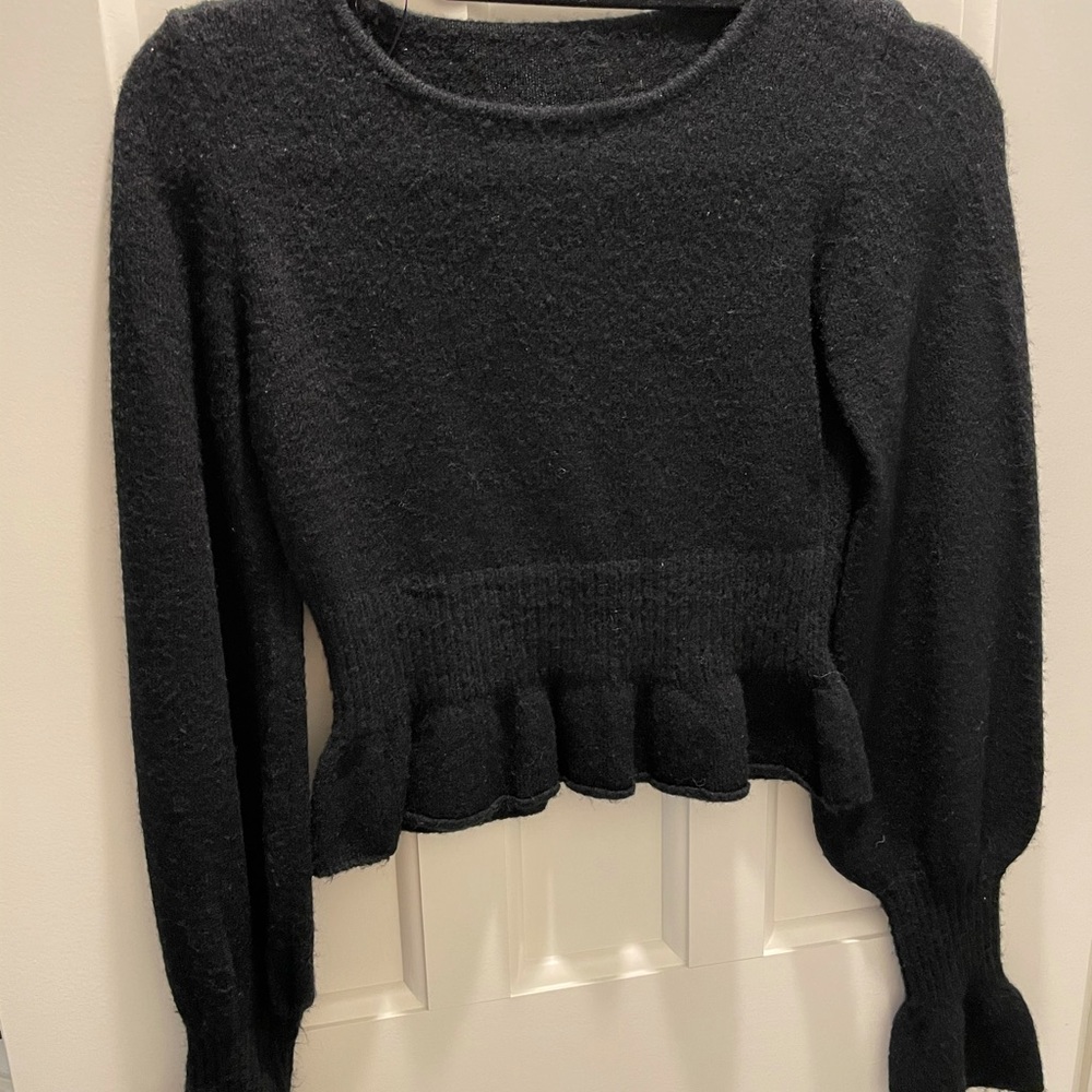 Black sweater with ruffle detailing